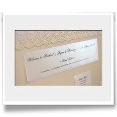 Hand crafted canvas table seating plan edged with lace
